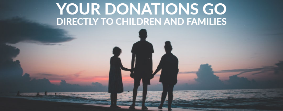 3 young people on beach at dawn looking at ocean waves holding hands.